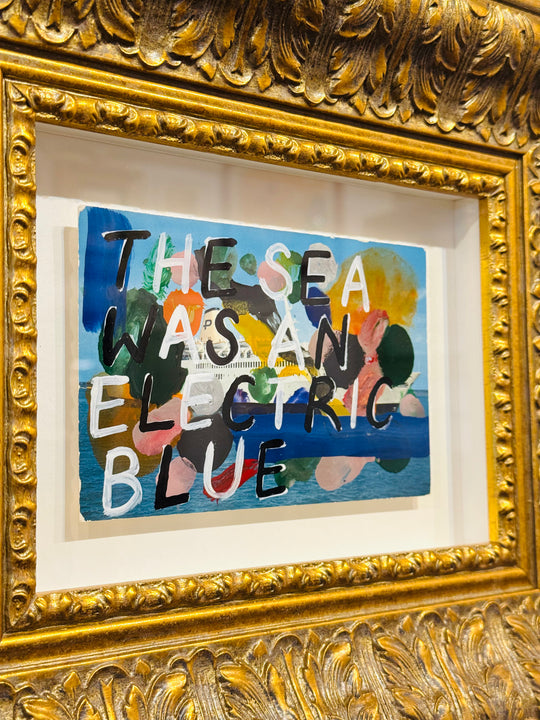 THE SEA WAS AN ELECTRiC BLUE